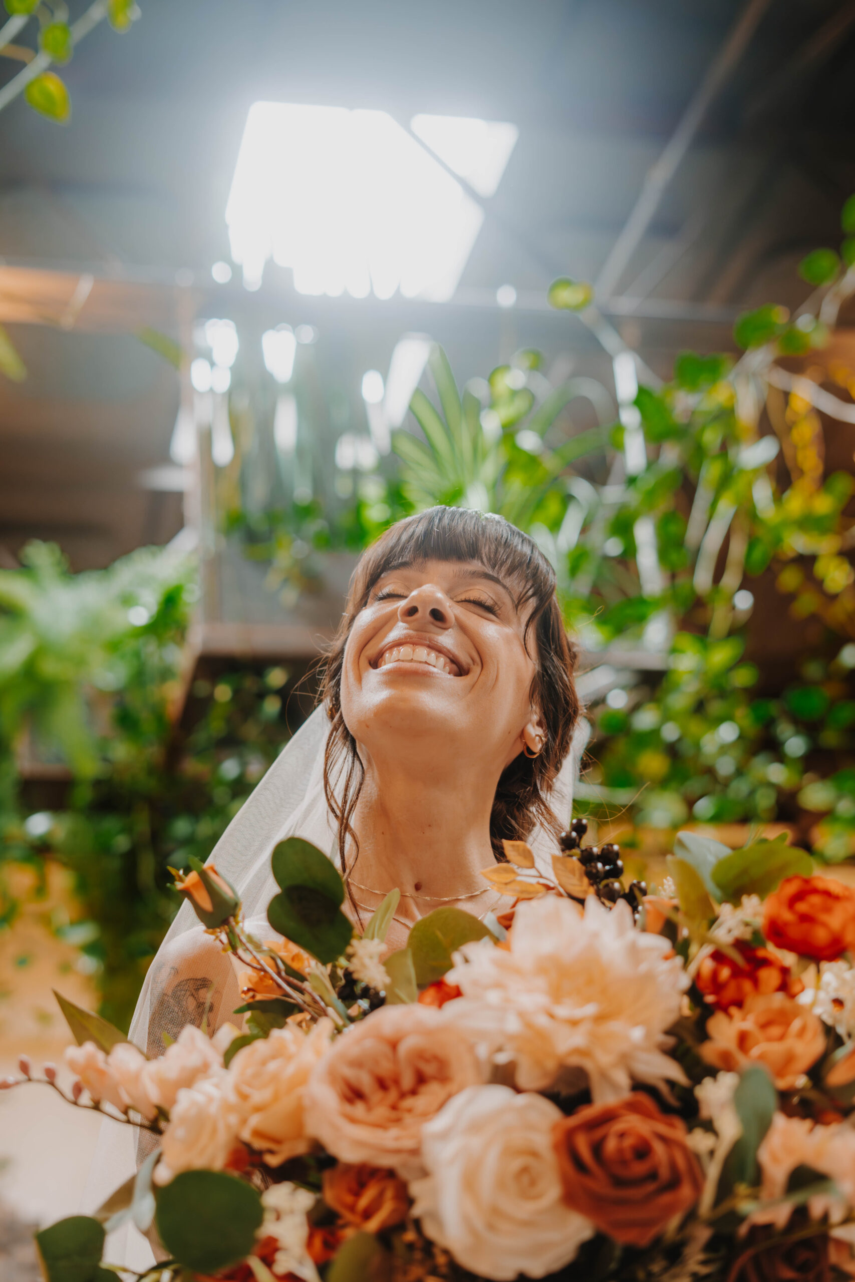 Bride looks up and smiles during her maine wedding
